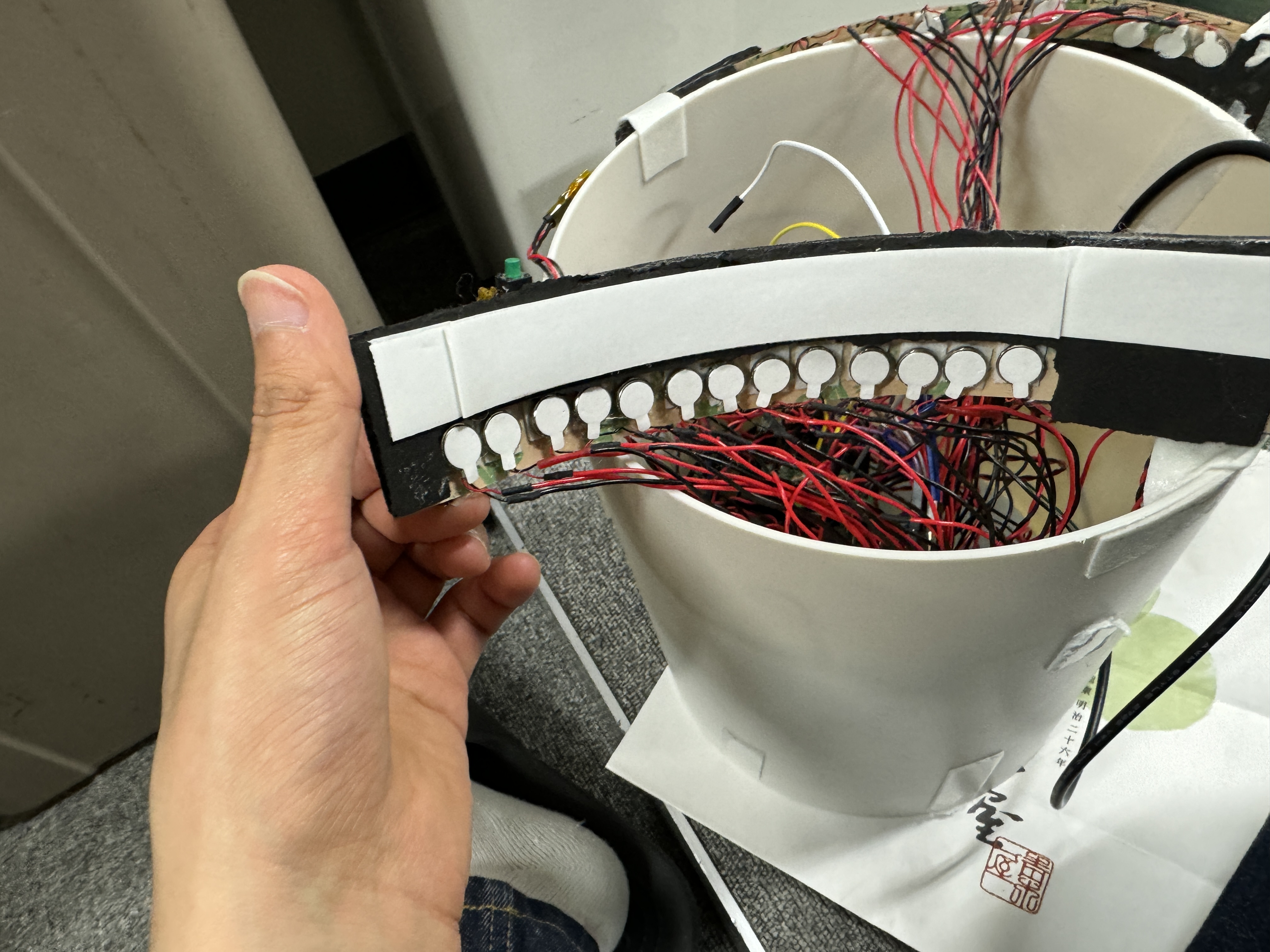 Close-up of the row of vibration motors and their wiring inside GakkiMakura